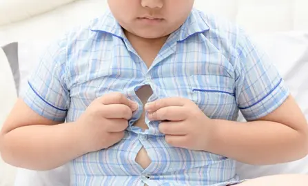 Obese fat boy overweight. Tight shirt of pajamas, healthy concept